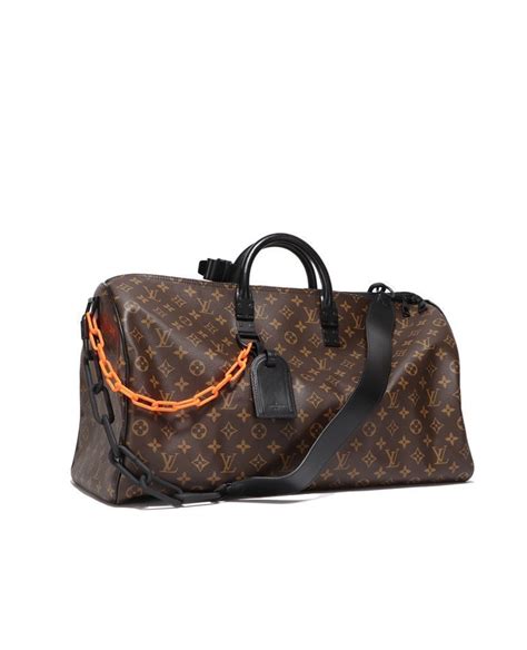 louis vuitton duffle bag orange chain|Louis Vuitton soft sided bag.